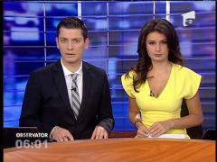 De 24 de ore, o femeie stă urcată pe acoperişul unui bloc din centrul Capitalei