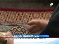 Un gospodar din judeţul Iaşi susține că Dumnezeu i-a trimis un mesaj pe o buturugă