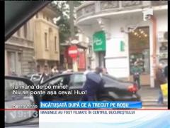 Șoferiță încătușată cu forța, după ce a trecut pe roșu