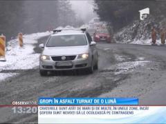 Lucrări de mântuială pe Drumul Naţional 76. Au apărut primele gropi în asfaltul turnat în decembrie