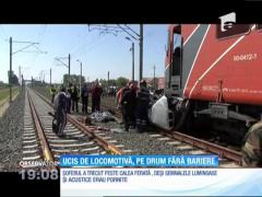 A murit spulberat de o locomotivă pe un drum fără bariere