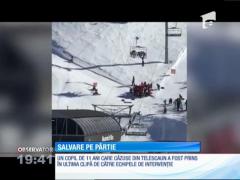 Un copil la un pas să cadă dintr-un telescaun, prins la limită