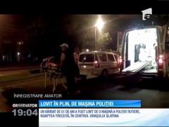 Bărbat lovit pe zebră de mașina poliției