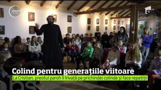 La Cristian, Braşov, copiii se pregătesc pentru colindat chiar cu preotul paroh al bisericii