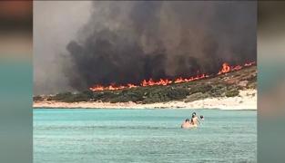 Disperare și panică pe insula Samotraki. Românii prizonieri, amenințați de un incendiu de vegetație