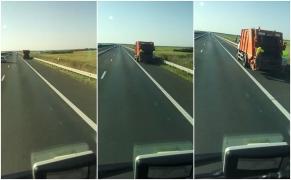 Viteză nebună cu maşina de gunoi pe autostradă, pe banda de urgenţă. Doi angajaţi fluturau pe scările din spate (Video)