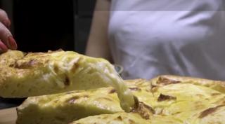 Pizza este printre cele mai răspândite preparate culinare de pe glob