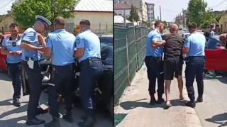 Șofer beat criță, care nu se putea ține pe picioare, scos de 4 polițiști din mașină, în Alexandria. Avea 2 sticle de palincă la el