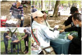 O familie de chinezi sărbătoreşte Paştele româneşte, la iarbă verde. Micii au sfârâit pe grătare în toată ţara