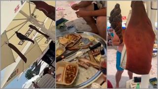 "Doar în Costineşti poţi vedea aşa ceva". Şi-au agăţat "costiţa" şi slana afumată de umbrelă şi au încins un ospăţ pe cinste pe plajă