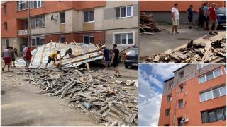Acoperişul unui bloc s-a desprins din cauza rafalelor puternice, în Alba. Zece maşini au fost serios avariate