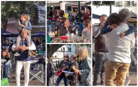 Ridicat pe umeri de oamenii de la terase, pe ritmurile unei melodii compuse pe loc, un copil şi-a regăsit tatăl, în centrul oraşului Buenos Aires