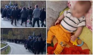 Un sat îndoliat, în urma sicriului lui Valentin. Copilul de un an din Vrancea, strangulat cu încărcătorul de la telefon, a fost înmormântat