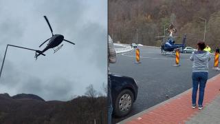 Un elicopter a aterizat în parcarea Mănăstirii Lainici din Gorj. Pilotul s-a gândit să facă o rugăciune şi câteva poze cu stareţul şi călugării