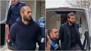 Fraţii Tate, flancaţi de jandarmi şi maşini de poliţie la audieri. Până acum şi-au strigat nevinovăţia, astăzi au fost mai tăcuţi ca niciodată