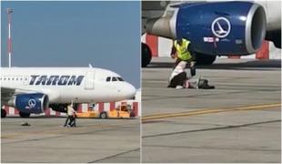 Imagini tragi-comice pe aeroportul Otopeni: O femeie cu bebeluş în braţe, filmată alergând pe pistă, după ce a întârziat la îmbarcare