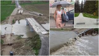 "N-am pe unde să trec. Doar înot!" Ploile abundente au umflat râul Putna, care a "înghiţit" un pod. Un ciclon aduce noi coduri galbene