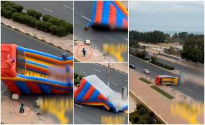 Tobogan gonflabil smuls de vânt şi răsturnat în mijlocul mașinilor, pe un drum din Kuweit. Unul dintre copii a fost izbit de trotuar