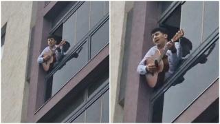 "Și-am găsit-o cu altcineva, Daniel Neagoe îl chema!". Tânărul înșelat de iubită, care amenință că se aruncă de la etajul 5, își cântă amarul de la balcon