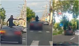 Doi bărbaţi urcaţi pe plafonul unei maşini în mers, filmaţi în timp ce ameninţau trecătorii cu armă de airsoft, în Turnu Măgurele