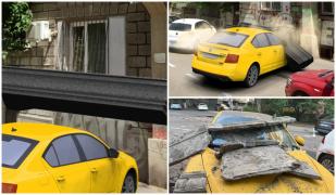 ANIMAŢIE. Maşina unui bucureştean făcută praf, după ce balconul unei clădiri a picat peste ea