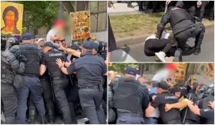 Momentul în care un bărbat cu un copil pe umeri atacă jandarmii la marșul Pride din Chișinău