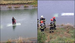 Momentul în care bătrânul și fetița din Argeș sunt salvați, după ce au plonjat cu maşina în canal