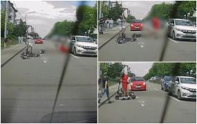 Momentul când un tânăr cade de pe trotinetă şi ajunge cu picioarele sub roţile unei maşini în Craiova