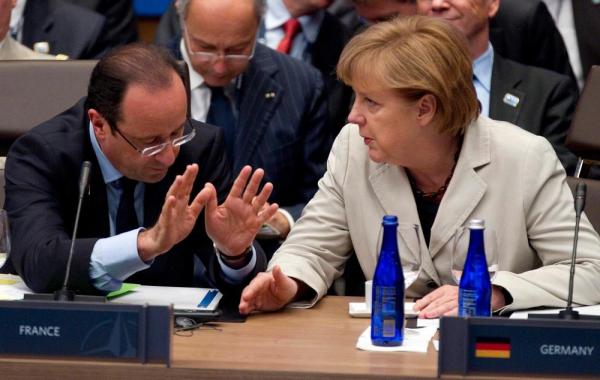 Hollande şi Merkel se implică în rezolvarea situaţiei din Ucraina