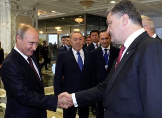 Moment istoric! Vladimir Putin a dat mâna cu Petro Poroşenko, la summitul de la Minsk