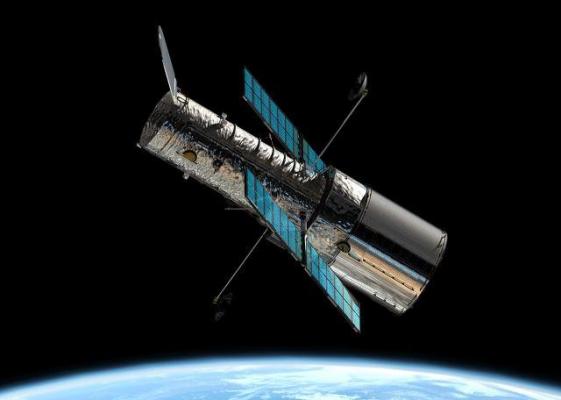 Hubble uimeşte din nou! Astronomii au descoperit o planetă care se învârte în jurul a două stele