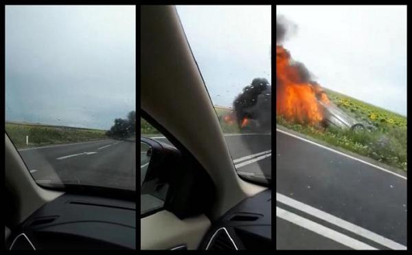 O maşină s-a răsturnat şi a luat foc pe şosea, în Tulcea. Imagini teribile de la locul accidentului (video)