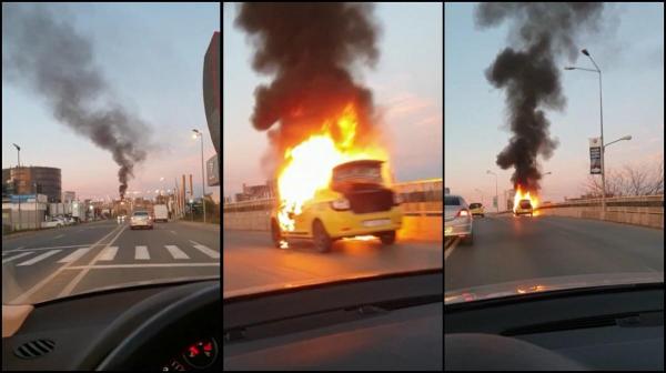 Imagini dramatice, în această dimineaţă, după ce un taxi a luat foc în mers, pe podul Pipera din Bucureşti