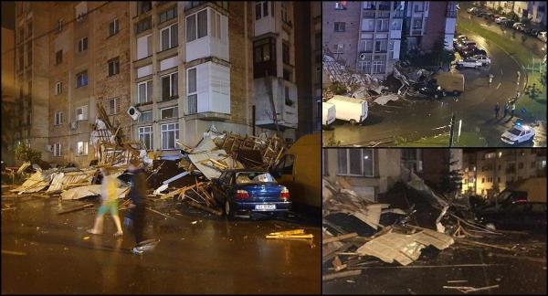 Dezastru în Craiova după o furtună violentă. Acoperişul unui bloc a ras mai multe balcoane şi s-a prăbuşit peste maşini (Video)