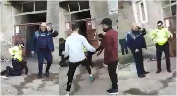 Un polițist este bruscat de mai mulți tineri în timp ce încătușează un bărbat, la Moinești