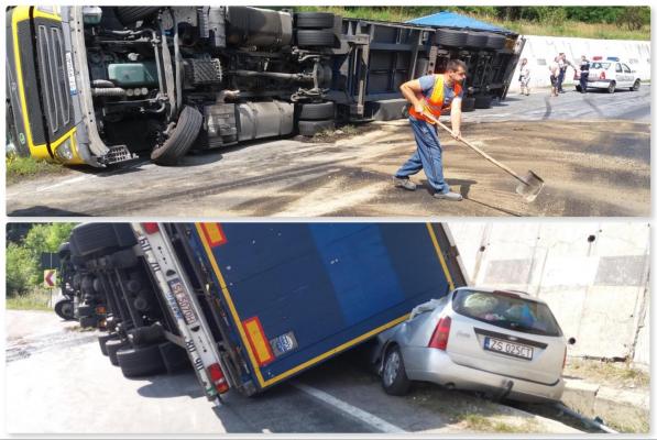 Șofer de TIR a pierdut controlul pe o urcare și s-a răsturnat peste o mașină
