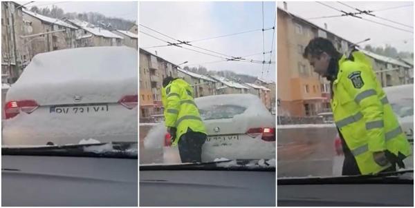 Video viral cu un polițist din Brașov care coboară din autospecială și șterge de zăpadă luneta mașinii din față