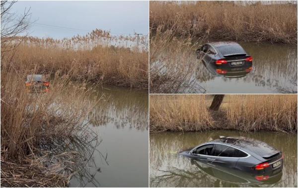 A plonjat cu Tesla în canal. Șoferul nu își amintește cum a ajuns în apă