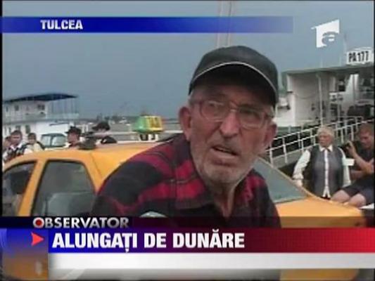Alungati de Dunare! Fluviul a inghitit un sat