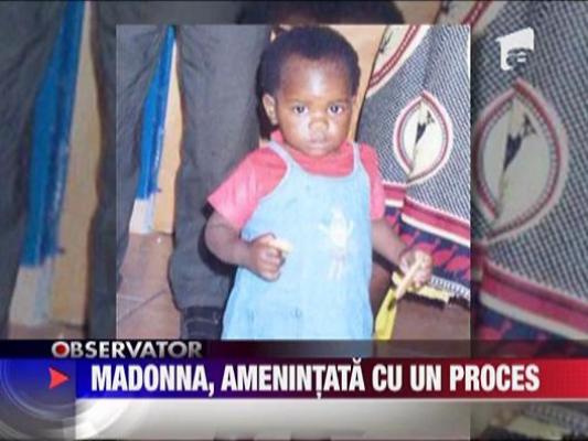 Madonna, amenintata de parintii fiicei adoptate