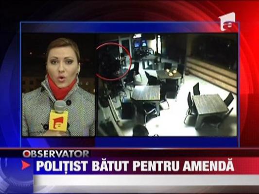 Politist batut pentru amenda