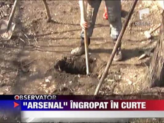 A gasit o punga cu 80 de cartuse ingropata in curte