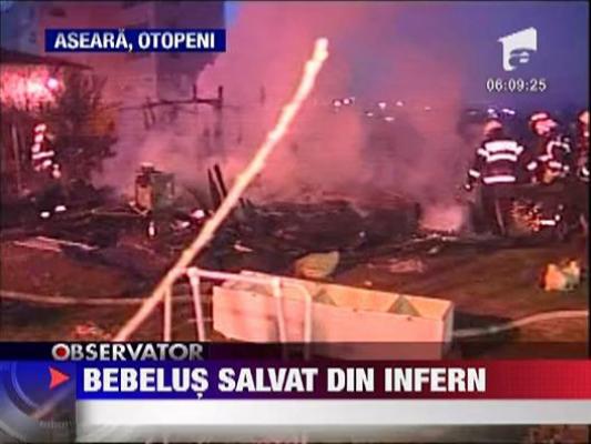 Bebelus salvat din flacari de tatal sau