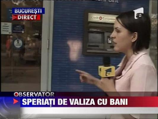 Speriati de o valiza cu bani