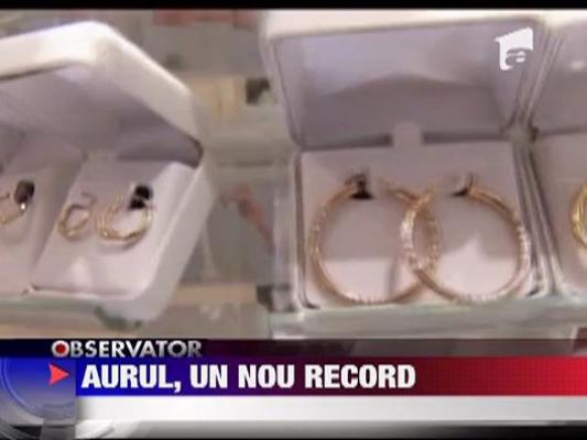 Pretul aurului bate record dupa record