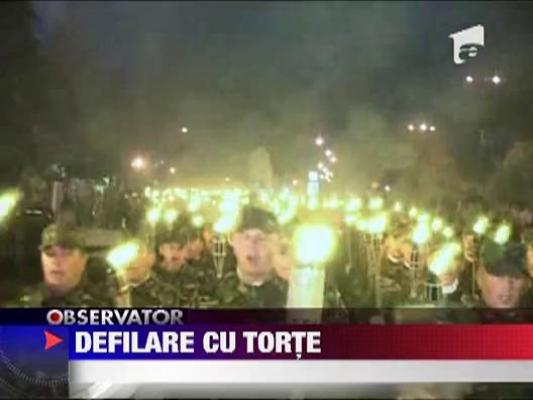 Defilare cu torte in maini