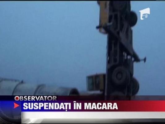 Suspendati in macara