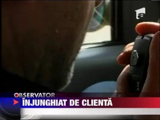 Taximetrist injunghiat de o clienta