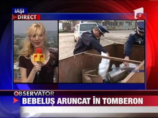 Bebelus aruncat in tomberon