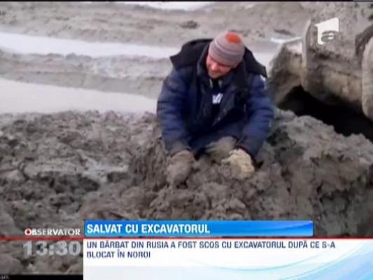 Dorel de Rusia! Muncitor scos cu excavatorul dupa ce s-a blocat in noroi